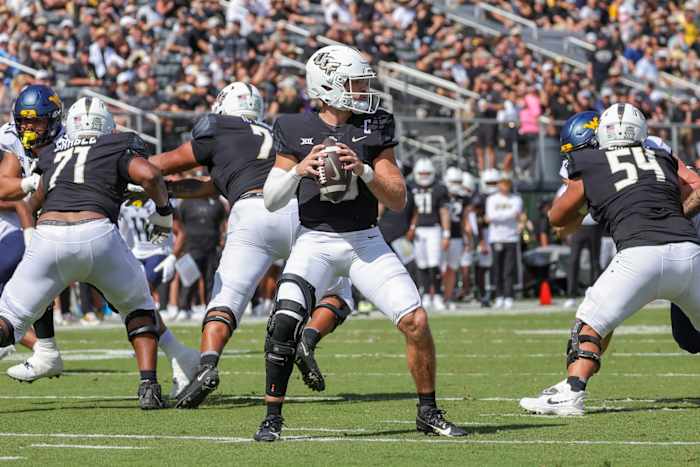 Oct 28, 2023; Orlando, Florida, USA; UCF Knights quarterback John Rhys Plumlee (10) prepares to pass during the second quarter against the West Virginia Mountaineers at FBC Mortgage Stadium.